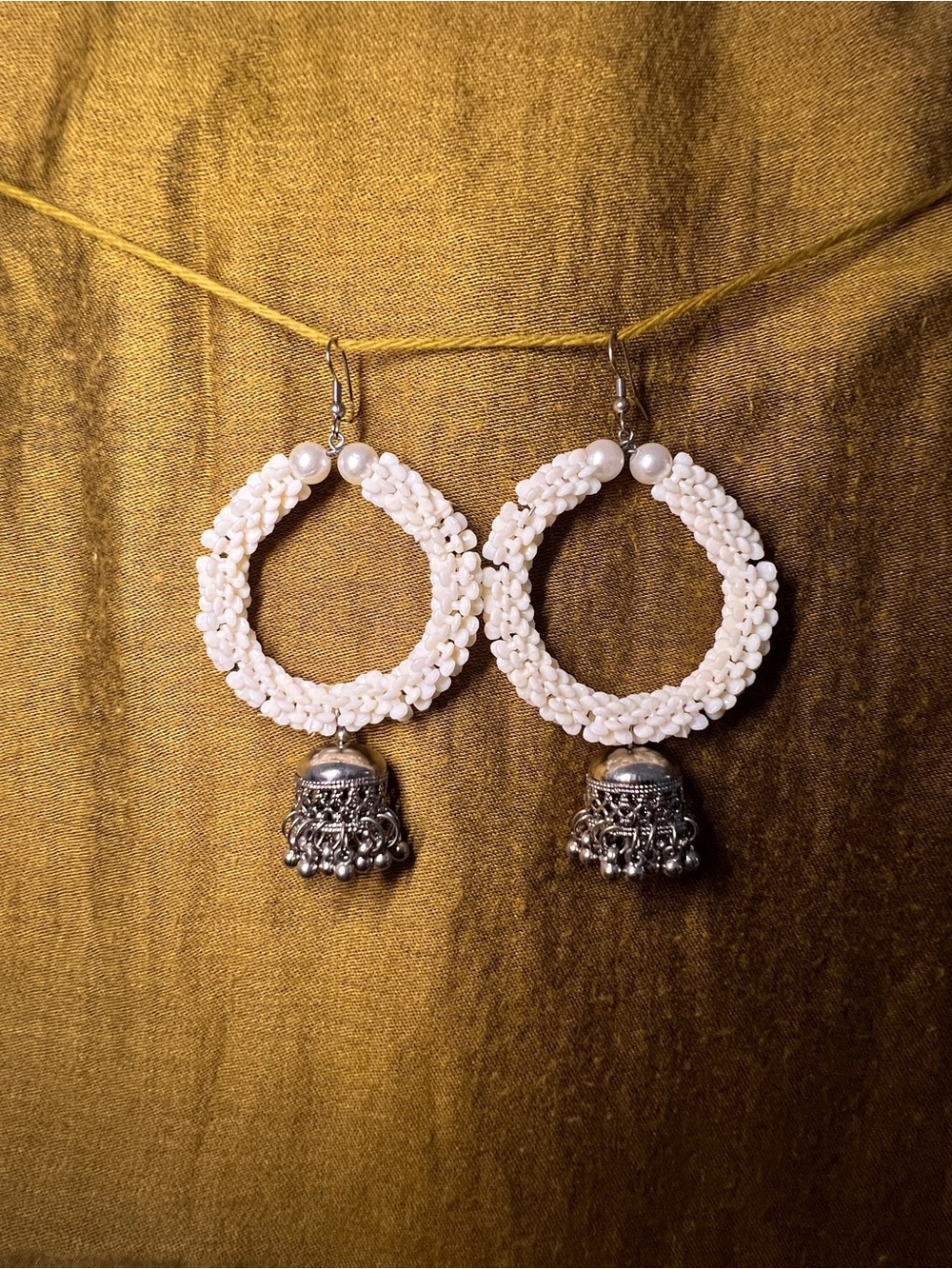 Handcrafted White Beaded Hoop Earrings with Silver Jhumka Detail
